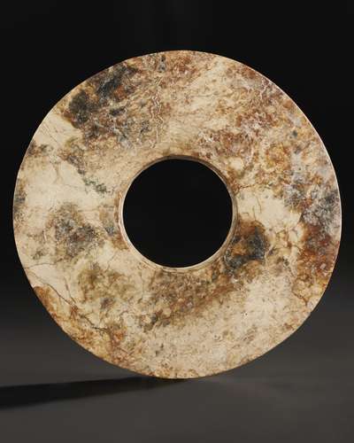 A MOTTLED BUFF AND BROWN JADE BI DISC