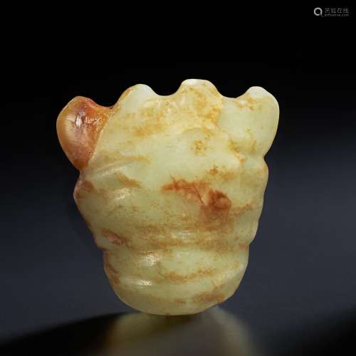 A RARE PALE YELLOWISH-GREEN JADE HORNED MASK PENDANT