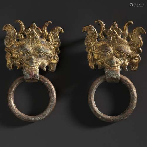 A PAIR OF SMALL GILT-BRONZE TAOTIE MASK FITTINGS