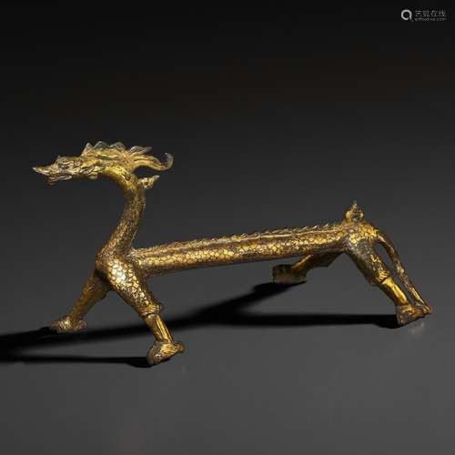 A RARE GILT-BRONZE FIGURE OF A DRAGON