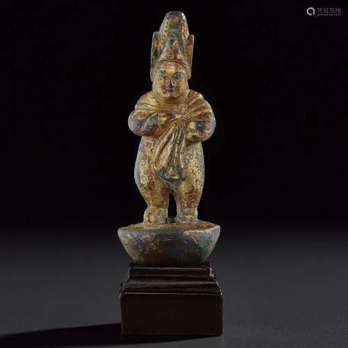 A RARE SMALL GILT-BRONZE STANDING FIGURE