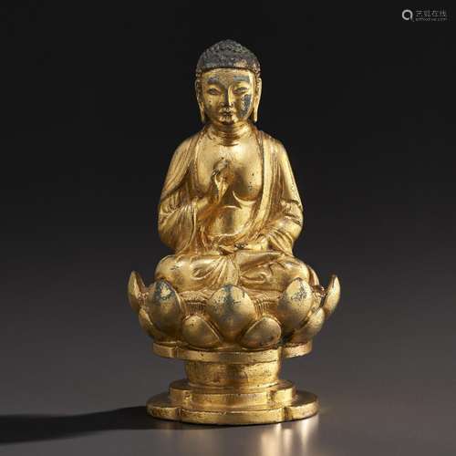 A GILT-BRONZE FIGURE OF SEATED BUDDHA