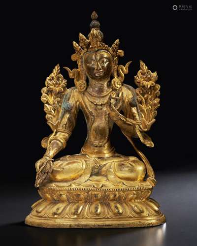 A GILT-BRONZE FIGURE OF A SEATED BODHISATTVA