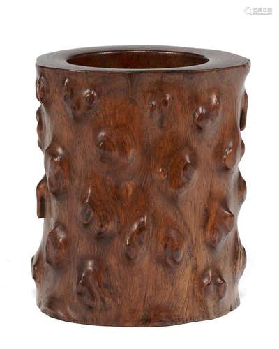 A CARVED HUANGHUALI ROOT-FORM BRUSH POT