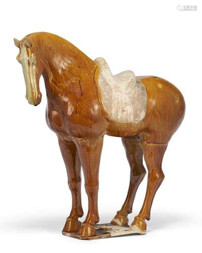 A LARGE AMBER-GLAZED POTTERY FIGURE OF A HORSE