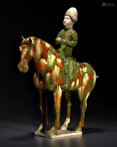 A RARE AND UNUSUAL SANCAI -GLAZED POTTERY EQUESTRIAN