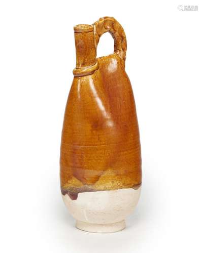 AN AMBER-GLAZED POTTERY FLASK