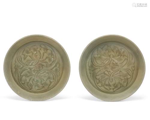 A RARE PAIR OF CARVED YAOZHOU CELADON SHALLOW BOWLS