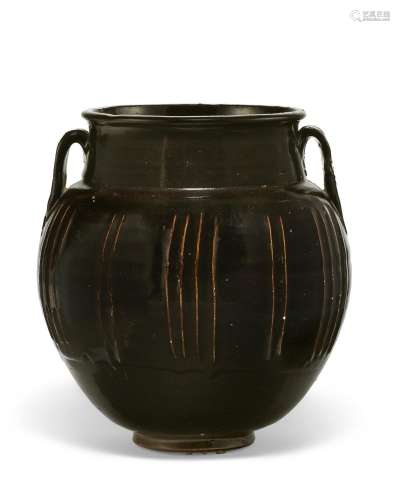 A LARGE BLACK-GLAZED WHITE-RIBBED JAR WITH TWO HANDLES