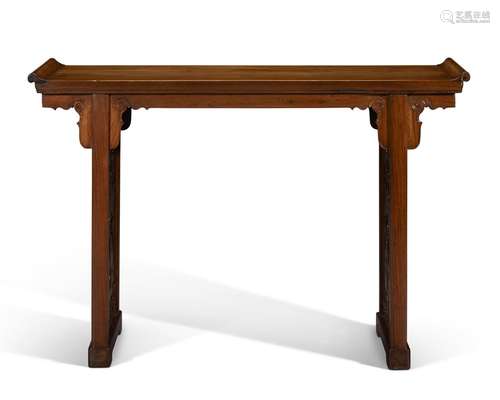 A HUANGHUALI TRESTLE-LEG TABLE