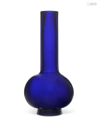 A LARGE BLUE GLASS BOTTLE VASE