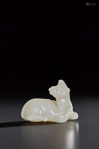 A SMALL PALE GREENISH-WHITE JADE FIGURE OF A HORNED BEAST