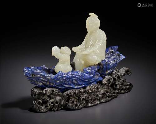 A RARE WHITE JADE AND LAPIS LAZULI CARVING OF FIGURES IN A L...