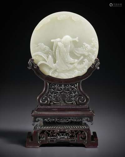 A WELL-CARVED GREENISH-WHITE JADE CIRCULAR PLAQUE