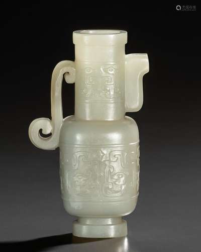 A SMALL WHITE JADE ARCHAISTIC POURING VESSEL