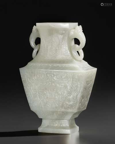 A FACETED PALE GREENISH-WHITE JADE VASE