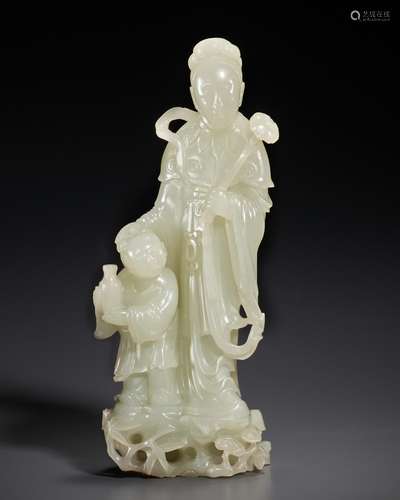 A FINELY CARVED WHITE JADE FIGURE OF A FEMALE IMMORTAL AND A...