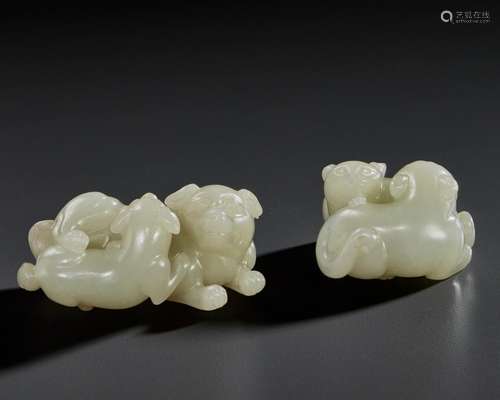 TWO PALE GREENISH-WHITE JADE CARVINGS OF PAIRED ANIMALS