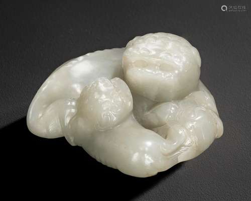 A PALE GREENISH-WHITE JADE BUDDHIST LION GROUP