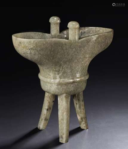 A PALE GREENISH-GREY JADE TRIPOD JUE -FORM VESSEL