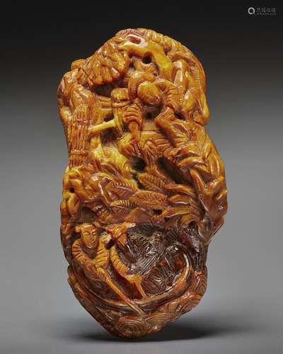 AN AMBER FIGURAL CARVING