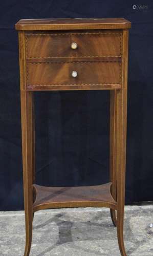 An Edwardian walnut two drawer two tier hall stand with inla...