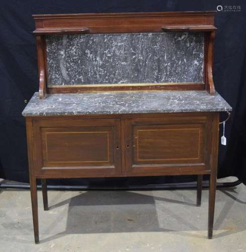 A marble topped wooden side board with a marble and wooden b...