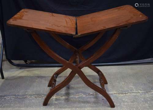 A wooden X frame folding occasional table 68 x 91 x 44cm.