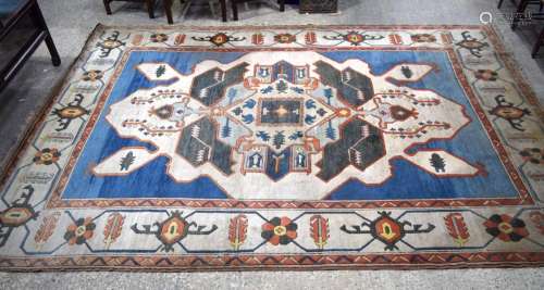 A large Persian wool rug 391 x 263 cm.