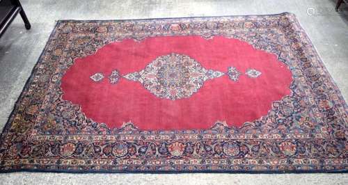 A large Persian rug 329 x 218 cm.