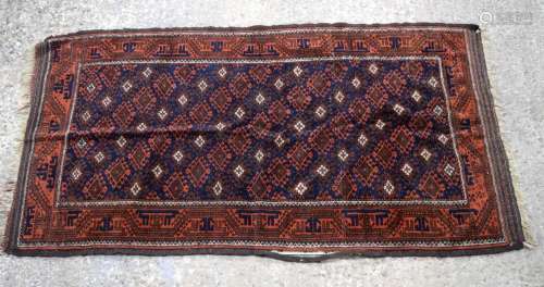 A Persian rug 175 x 93 cm.