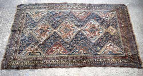 A large Persian rug 246 x150cm.