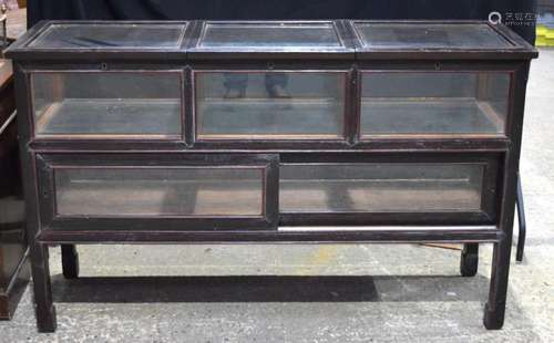 A 20th century Chinese wooden and glass display case with th...