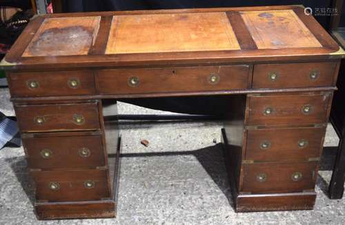 A leather topped pedestal writing bureau with 9 drawers 76 x...