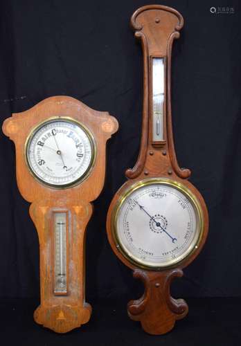 A wooden early 20th century barometer together with another ...