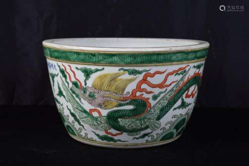 A large Chinese porcelain Wucai fish bowl decorated with dra...