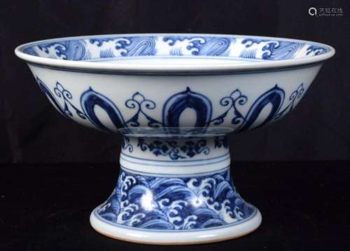 A large Chinese porcelain blue and white stem cup decorated ...