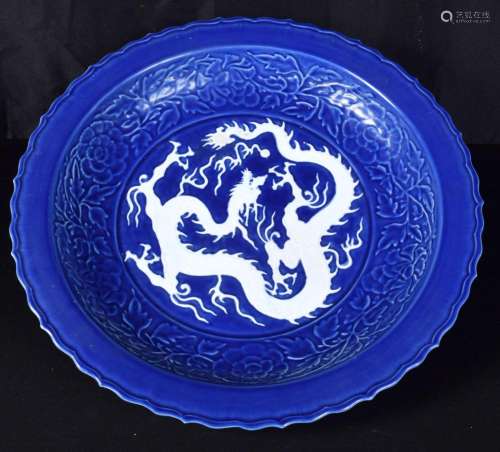 A large Chinese porcelain sacrificial blue ground dish decor...