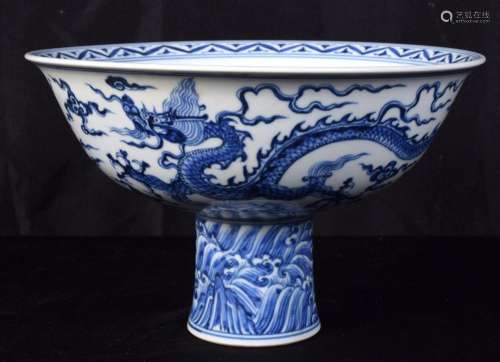 A large Chinese porcelain blue and white stem cup decorated ...