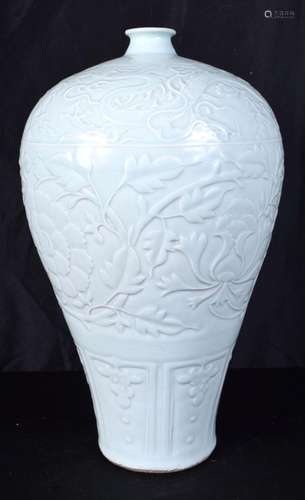 A large Chinese Celadon Meiping vase decorated in relief wit...