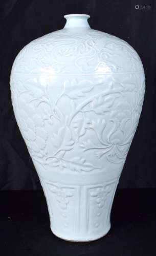 A large Chinese Celadon Meiping vase decorated in relief wit...