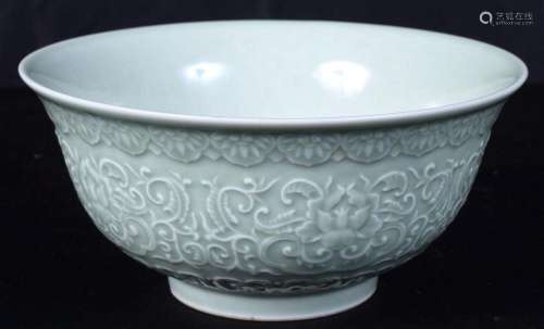 A Chinese porcelain Celadon bowl decorated in relief with ei...