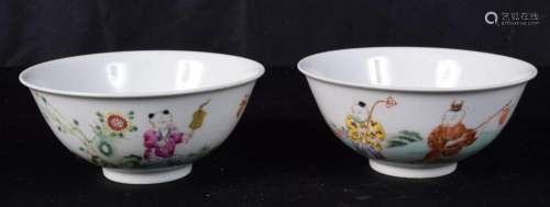 A pair of Chinese porcelain Famille-Rose rice bowls decorate...