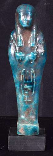 A glazed pottery Egyptian Shabti. 16cm