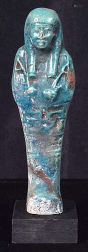 A glazed pottery Egyptian Shabti. 14cm