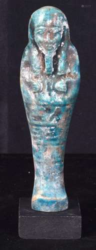 A glazed pottery Egyptian Shabti. 15cm