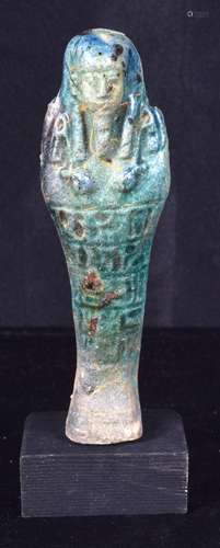 A glazed pottery Egyptian Shabti. 12cm