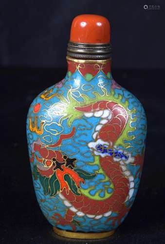 A Cloisonne enamelled snuff bottle decorated with a dragon. ...