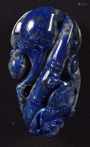 A carved Lapis Lazuli boulder in the form of a fruiting pod ...