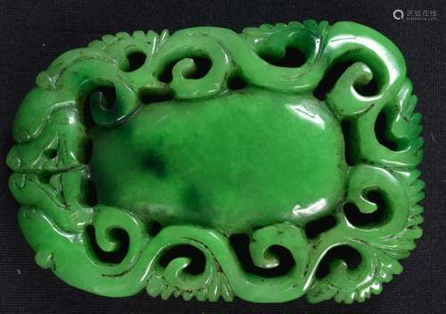 A carved Jade dragon pendant. 9 x 6cm